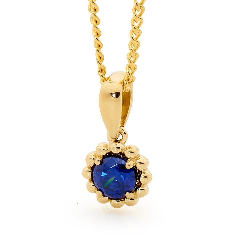 Cute Flower pendant with Iris Blue CZ - Micro Gems