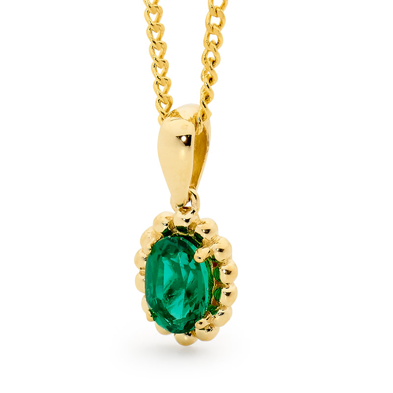 Oval Emerald pendant with Gold Bead Surround